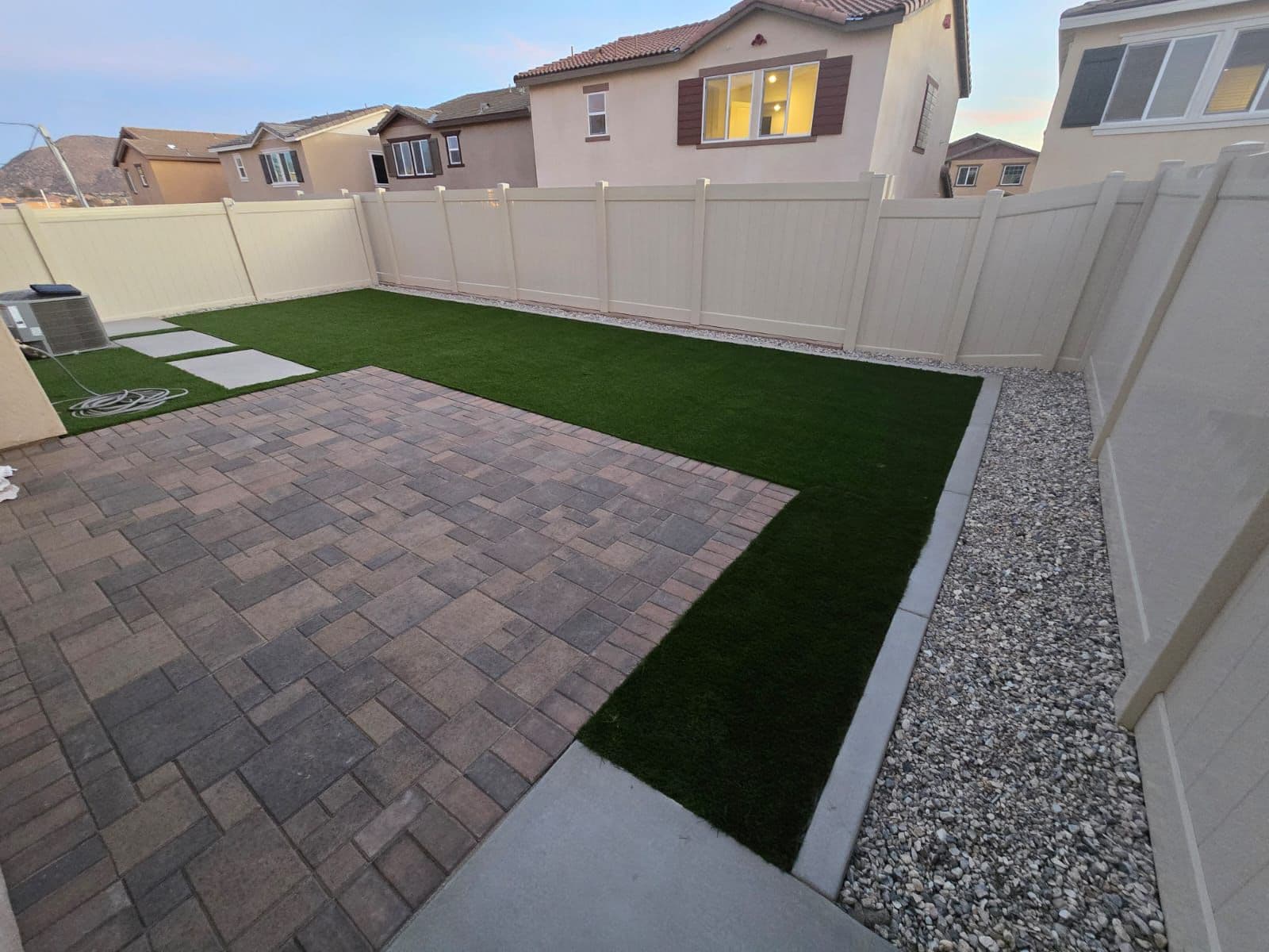 Artificial turf installation in a drought-friendly California yard